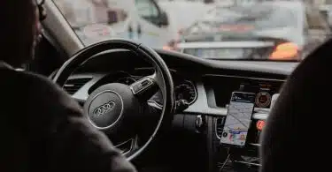 man in black jacket driving car during daytime